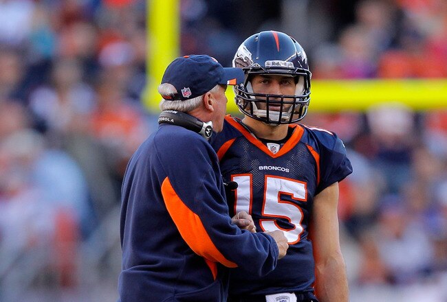 DENVER, CO - DECEMBER 18:  Head coach John Fox of the Denver Broncos talks with Quarterback Tim Tebow #15 during a game against the New England Patriots at Sports Authority Field at Mile High on December 18, 2011 in Denver, Colorado.  (Photo by Justin Edmonds/Getty Images)