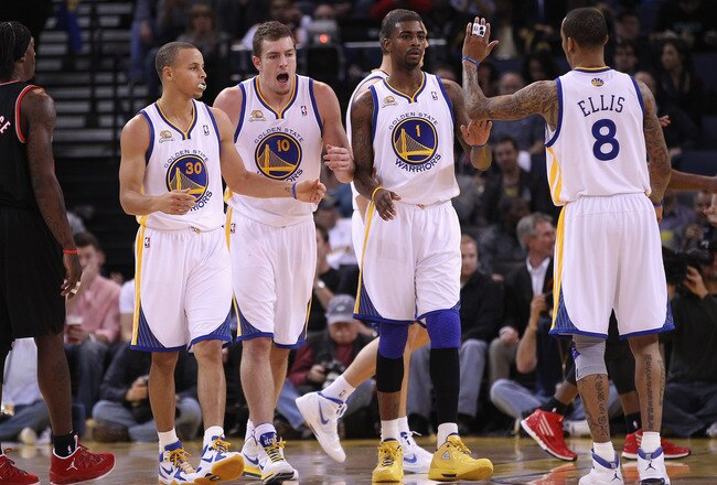 OAKLAND, CA - FEBRUARY 15:  Stephen Curry #30, David Lee #10, Dorell Wright #1 and Monta Ellis #8 of the Golden State Warriors celebrate after a basket during their game against the Portland Trail Blazers at Oracle Arena on February 15, 2012 in Oakland, California. NOTE TO USER: User expressly acknowledges and agrees that, by downloading and or using this photograph, User is consenting to the terms and conditions of the Getty Images License Agreement.  (Photo by Ezra Shaw/Getty Images)