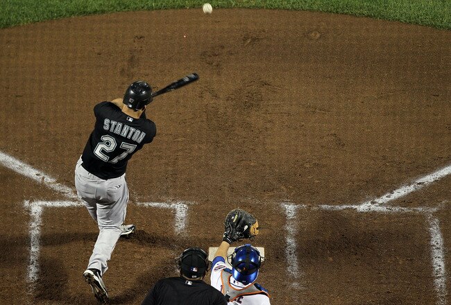 NEW YORK, NY - AUGUST 30:  Mike Stanton #27 of the Florida Marlins connects on a fourth inning base hit against the New York Mets at Citi Field on August 30, 2011 in the Flushing neighborhood of the Queens borough of New York City.  (Photo by Jim McIsaac/Getty Images)
