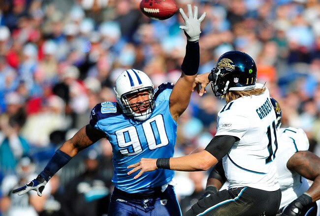 NASHVILLE, TN - DECEMBER 24:  Derrick Morgan #90 of the Tennessee Titans pressures a pass by Blaine Gabbert #11 of the Jacksonville Jaguars during play at LP Field on December 24, 2011 in Nashville, Tennessee.  (Photo by Grant Halverson/Getty Images)