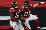 ATLANTA, GA - JANUARY 01:  Curtis Lofton #50 of the Atlanta Falcons celebrates an interception return for a touchdown against the Tampa Bay Buccaneers with Thomas DeCoud #28 at Georgia Dome on January 1, 2012 in Atlanta, Georgia.  (Photo by Kevin C. Cox/Getty Images)