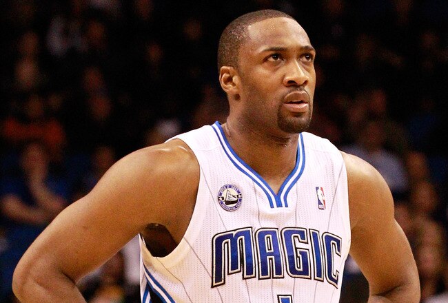 ORLANDO, FL - JANUARY 24:  Gilbert Arenas #1 of the Orlando Magic looks at the scoreboard during the game against the Detroit Pistons at Amway Arena on January 24, 2011 in Orlando, Florida.  NOTE TO USER: User expressly acknowledges and agrees that, by downloading and or using this Photograph, user is consenting to the terms and conditions of the Getty Images License Agreement.  (Photo by Sam Greenwood/Getty Images)