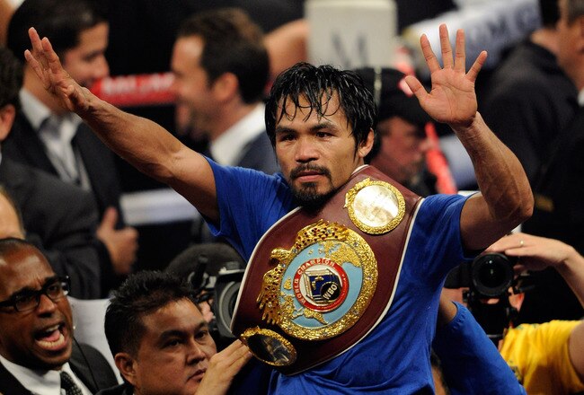 LAS VEGAS, NV - MAY 07:  Manny Pacquiao of the Philippines celebrates after his unanimous decision victory against Shane Mosley in the WBO welterweight title fight at MGM Grand Garden Arena on May 7, 2011 in Las Vegas, Nevada.  (Photo by Ethan Miller/Getty Images)