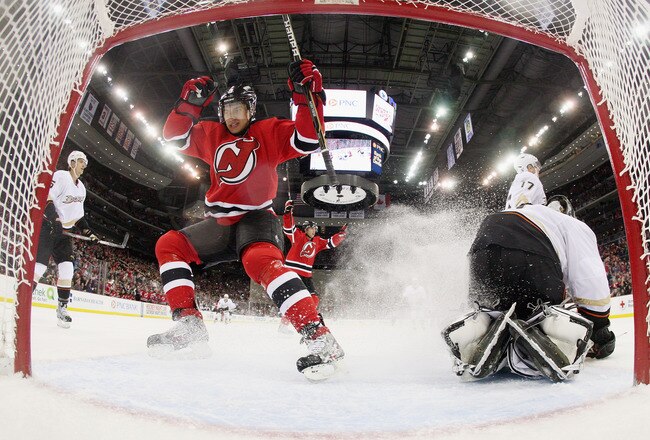 NEWARK, NJ - FEBRUARY 17:  Alexei Ponikarovsky #12 (not shown) of the New Jersey Devils scores at 10:56 of the second period against the Anaheim Ducks as Dainius Zubrus #8 celebrates in the crease at the Prudential Center on February 17, 2012 in Newark, New Jersey.  (Photo by Bruce Bennett/Getty Images)