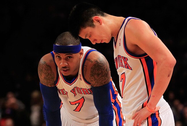 NEW YORK, NY - FEBRUARY 20: Carmelo Anthony #7 and Jeremy Lin #17 of the New York Knicks stand on the court against the New Jersey Nets at Madison Square Garden on February 20, 2012 in New York City. NOTE TO USER: User expressly acknowledges and agrees that, by downloading and/or using this Photograph, user is consenting to the terms and conditions of the Getty Images License Agreement.  (Photo by Chris Trotman/Getty Images)