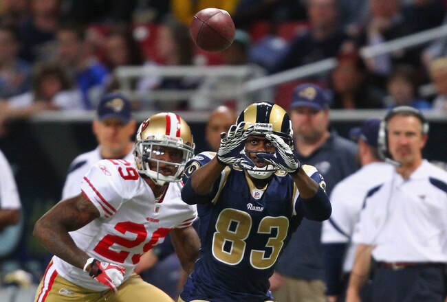 ST. LOUIS, MO - JANUARY 1: Brandon Lloyd #83 of the St. Louis Rams looks to make a catch against Chris Culliver #29 of the San Francisco 49ers at the Edward Jones Dome on January 1, 2012 in St. Louis, Missouri.  The 49ers beat the Rams 34-27.  (Photo by Dilip Vishwanat/Getty Images)