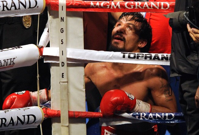 LAS VEGAS, NV - NOVEMBER 12:  Boxer Manny Pacquiao prays in the corner of the ring after his WBO world welterweight title fight against Juan Manuel Marquez at the MGM Grand Garden Arena November 12, 2011 in Las Vegas, Nevada. Pacquiao retained his title with a majority decision victory.  (Photo by Ethan Miller/Getty Images)