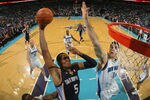 NEW ORLEANS, LA - JANUARY 18:  Marreese Speights #5 of the Memphis Grizzlies shoots the ball over Jason Smith #14 of the New Orleans Hornets at New Orleans Arena on January 18, 2012 in New Orleans, Louisiana.  NOTE TO USER: User expressly acknowledges and agrees that, by downloading and or using this photograph, User is consenting to the terms and conditions of the Getty Images License Agreement.  (Photo by Chris Graythen/Getty Images)