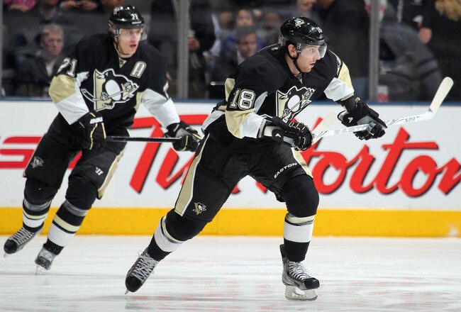 TORONTO, CANADA - FEBRUARY 1:  James Neal #18 and Evgeny Malkin #71 of the Pittsburgh Penguins skate in a game against the Toronto Maple Leafs on February 1, 2012 at the Air Canada Centre in Toronto, Canada. The Leafs defeated the Penguins 1-0. (Photo by Claus Andersen/Getty Images)