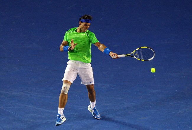 MELBOURNE, AUSTRALIA - JANUARY 29:  Rafael Nadal of Spain plays a forehand in his men's final match against Novak Djokovic of Serbia during day fourteen of the 2012 Australian Open at Melbourne Park on January 29, 2012 in Melbourne, Australia.  (Photo by Cameron Spencer/Getty Images)