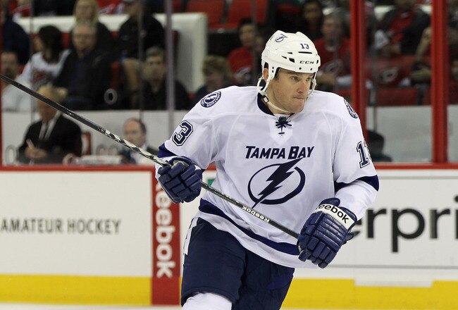 RALEIGH, NC - OCTOBER 07:  Pavel Kubina #13 of the Tampa Bay Lightning skates against the Carolina Hurricanes at the RBC Center on October 7, 2011 in Raleigh, North Carolina. The Lightning defeated the Hurricanes 5-1.  (Photo by Bruce Bennett/Getty Images)