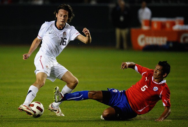 CARSON, CA - JANUARY 22: Sebastian Toro #5 of Chile tackles Mixx Diskerud #16 of the United States during the friendly soccer match at The Home Depot Center on January 22, 2011 in Carson, California. (Photo by Kevork Djansezian/Getty Images)