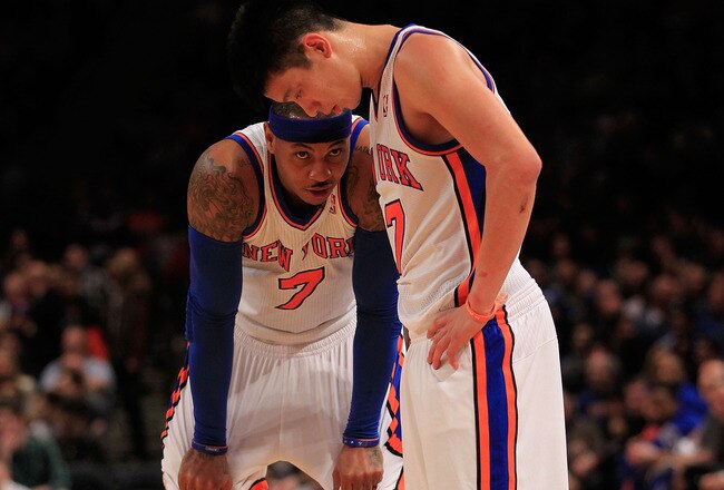 NEW YORK, NY - FEBRUARY 20: Carmelo Anthony #7 and Jeremy Lin #17 of the New York Knicks stand on the court against the New Jersey Nets at Madison Square Garden on February 20, 2012 in New York City. NOTE TO USER: User expressly acknowledges and agrees that, by downloading and/or using this Photograph, user is consenting to the terms and conditions of the Getty Images License Agreement.  (Photo by Chris Trotman/Getty Images)