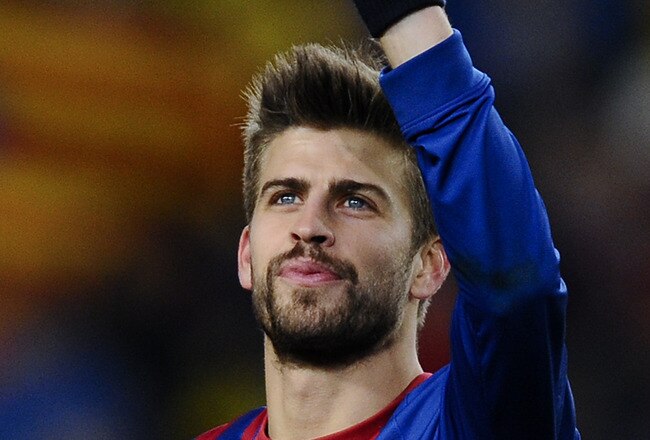 BARCELONA, SPAIN - FEBRUARY 08:  Gerard Pique of FC Barcelona celebrates after defeating Valencia at the end of the Copa del Rey Semi Final 2nd leg match between FC Barcelona and Valencia  at Nou Camp on February 8, 2012 in Barcelona, Spain. Barcelona wn 2-0.  (Photo by David Ramos/Getty Images)
