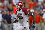 AUBURN - OCTOBER 16:  Wide receiver Greg Childs #85 of the Arkansas Razorbacks makes a reception and runs for a touchdown in the fourth quarter during the game against the Auburn Tigers at Jordan-Hare Stadium on October 16, 2010 in Auburn, Alabama.  The Tigers beat the Razorbacks 65-43.  (Photo by Mike Zarrilli/Getty Images)