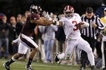 STARKVILLE, MS - NOVEMBER 12:  Running back Trent Richardson #3 of the Alabama Crimson Tide stiff arms defensive back Wade Bonner #7 of the Mississippi State Bulldogs during a big first down run in the fourth quarter on November 12, 2011 at Davis Wade Stadium in Starkville, Mississippi. (Photo by Butch Dill/Getty Images)