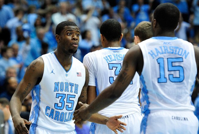 CHAPEL HILL, NC - JANUARY 26:  Reggie Bullock #35 and P.J. Hairston #15 of the North Carolina Tar Heels against the North Carolina State Wolfpack during play at the Dean Smith Center on January 26, 2012 in Chapel Hill, North Carolina. North Carolina won 74-55.  (Photo by Grant Halverson/Getty Images)