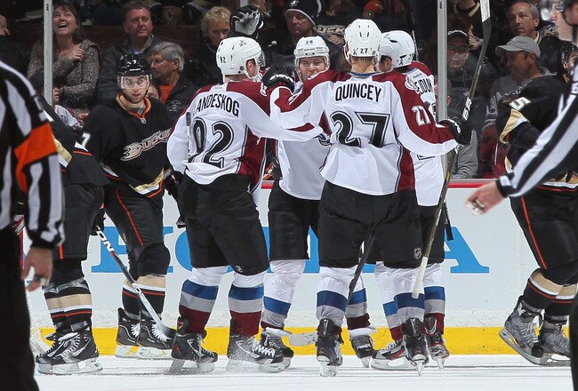 ANAHEIM, CA - JANUARY 22:  (L-R) Gabriel Landeskog #92, Paul Stastny #26, Kyle Quincey #27 and Milan Hejduk #23 of the Colorado Avalanche celebrate Hejduk's third period goal as Andrew Cogliano #7 of the Anaheim Ducks looks on during the NHL game at Honda Center on January 22, 2012 in Anaheim, California. The Ducks defeated the Avalanche 3-2. (Photo by Victor Decolongon/Getty Images)