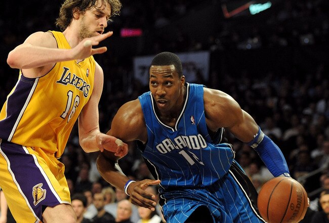 LOS ANGELES, CA - JANUARY 18:  Dwight Howard #12 of the Orlando Magic drives against Pau Gasol #16 of the Los Angeles Lakers in the fourth quarter during the game on January 18, 2010 at Staples Center in Los Angeles, California. The Lakers won 98-92. NOTE TO USER: User expressly acknowledges and agrees that, by downloading and/or using this Photograph, user is consenting to the terms and conditions of the Getty Images License Agreement.  (Photo by Harry How/Getty Images)