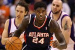 PHOENIX, AZ - FEBRUARY 15:  Marvin Williams #24 of the Atlanta Hawks handles the ball during the NBA game against the Phoenix Suns at US Airways Center on February 15, 2012 in Phoenix, Arizona. The Hawks defeated the Suns 101-99.  NOTE TO USER: User expressly acknowledges and agrees that, by downloading and or using this photograph, User is consenting to the terms and conditions of the Getty Images License Agreement.  (Photo by Christian Petersen/Getty Images)