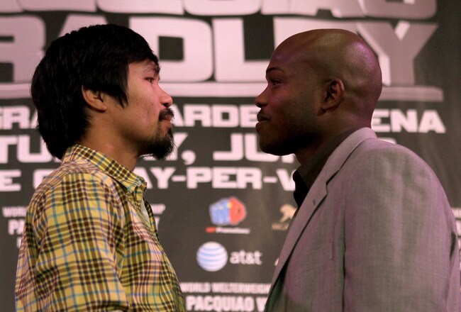 BEVERLY HILLS, CA - FEBRUARY 21:  Manny Pacquiao (L) and Timothy Bradley pose for photographers at a press conference announcing their upcoming World Boxing Organization welterweight championship fight at The Beverly Hills Hotel on February 21, 2012 in Beverly Hills, California.  (Photo by Stephen Dunn/Getty Images)