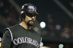 PHOENIX, AZ - MAY 03:  Todd Helton #17 of the Colorado Rockies walks to the dugout during the Major League Baseball against the Arizona Diamondbacks game at Chase Field on May 3, 2011 in Phoenix, Arizona.  The Diamondbacks defeated the Rockies 4-3.  (Photo by Christian Petersen/Getty Images)