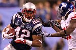 INDIANAPOLIS, IN - FEBRUARY 05:  Runningback BenJarvus Green-Ellis #42 of the New England Patriots runs the ball against Kenny Phillips #21 and Michael Boley #59 of the New York Giants in the third quarter during Super Bowl XLVI at Lucas Oil Stadium on February 5, 2012 in Indianapolis, Indiana.  (Photo by Al Bello/Getty Images)