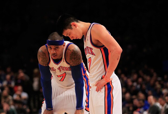 NEW YORK, NY - FEBRUARY 20: Carmelo Anthony #7 and Jeremy Lin #17 of the New York Knicks stand on the court against the New Jersey Nets at Madison Square Garden on February 20, 2012 in New York City. NOTE TO USER: User expressly acknowledges and agrees that, by downloading and/or using this Photograph, user is consenting to the terms and conditions of the Getty Images License Agreement.  (Photo by Chris Trotman/Getty Images)