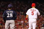 ST LOUIS, MO - OCTOBER 14:  Prince Fielder #28 of the Milwaukee Brewers and Albert Pujols #5 of the St. Louis Cardinals stnad near first base during Game Five of the National League Championship Series at Busch Stadium on October 14, 2011 in St Louis, Missouri.  (Photo by Dilip Vishwanat/Getty Images)