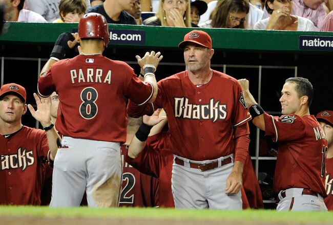 WASHINGTON, DC - AUGUST 24:  Gerardo Parra #8 of the Arizona Diamondbacks is congratulated by manager Kirk Gibson #23 after scoring in the eighth inning against the Washington Nationals at Nationals Park on August 24, 2011 in Washington, DC.  (Photo by Greg Fiume/Getty Images)