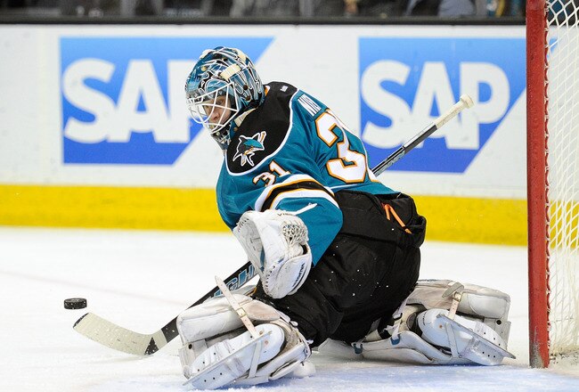 SAN JOSE, CA - FEBRUARY 08:  Goaltenter Antti Niemi #31 of the San Jose Sharks makes a glove-hand save against the Calgary Flames at HP Pavilion at San Jose on February 8, 2012 in San Jose, California.  (Photo by Thearon W. Henderson/Getty Images)