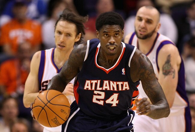 PHOENIX, AZ - FEBRUARY 15:  Marvin Williams #24 of the Atlanta Hawks handles the ball during the NBA game against the Phoenix Suns at US Airways Center on February 15, 2012 in Phoenix, Arizona. The Hawks defeated the Suns 101-99.  NOTE TO USER: User expressly acknowledges and agrees that, by downloading and or using this photograph, User is consenting to the terms and conditions of the Getty Images License Agreement.  (Photo by Christian Petersen/Getty Images)
