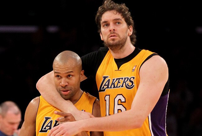LOS ANGELES, CA - JANUARY 16:  Derek Fisher #2 of the Los Angeles Lakers celebrates with Pau Gasol #16 after Fisher stole the ball and scored a break away basket against the Dallas Mavericks at Staples Center on January 16, 2012 in Los Angeles, California.  The Lakers won 73-70.  NOTE TO USER: User expressly acknowledges and agrees that, by downloading and or using this photograph, User is consenting to the terms and conditions of the Getty Images License Agreement.  (Photo by Stephen Dunn/Getty Images)