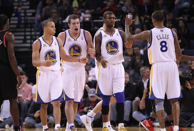OAKLAND, CA - FEBRUARY 15:  Stephen Curry #30, David Lee #10, Dorell Wright #1 and Monta Ellis #8 of the Golden State Warriors celebrate after a basket during their game against the Portland Trail Blazers at Oracle Arena on February 15, 2012 in Oakland, California. NOTE TO USER: User expressly acknowledges and agrees that, by downloading and or using this photograph, User is consenting to the terms and conditions of the Getty Images License Agreement.  (Photo by Ezra Shaw/Getty Images)