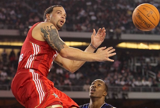 ARLINGTON, TX - FEBRUARY 14:  Deron Williams #8 of the Western Conference passes against Dwight Howard #12 of the Eastern Conference during the NBA All-Star Game, part of 2010 NBA All-Star Weekend at Cowboys Stadium on February 14, 2010 in Arlington, Texas. The Eastern Conference defeated the Western Conference 141-139 in regulation. NOTE TO USER: User expressly acknowledges and agrees that, by downloading and or using this photograph, User is consenting to the terms and conditions of the Getty Images License Agreement.  (Photo by Jed Jacobsohn/Getty Images)