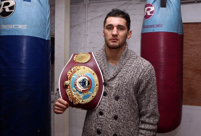 LONDON, ENGLAND - FEBRUARY 02:  Nathan Cleverly, the WBO World Light-Heavyweight Champion poses with his belt at the Peacock Gym as he prepares for his third title defence against American Tommy Karpency on February 2, 2012 in London, England.  (Photo by Julian Finney/Getty Images)