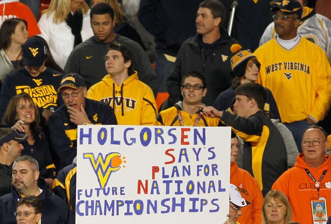 MIAMI GARDENS, FL - JANUARY 04:  Fans of the West Virginia Mountaineers hold up a sign in support of head coach Dana Holgorsen against the Clemson Tigers during the Discover Orange Bowl at Sun Life Stadium on January 4, 2012 in Miami Gardens, Florida.  (Photo by Streeter Lecka/Getty Images)