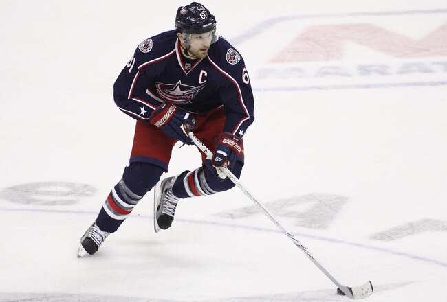 COLUMBUS, OH - JANUARY 19:  Rick Nash #61 of the Columbus Blue Jackets skates the puck up ice during the game against the Nashville Predators at Nationwide Arena on January 19, 2012 in Columbus, Ohio.  The Predators defeated the Blue Jackets 3-0.  (Photo by John Grieshop/Getty Images)
