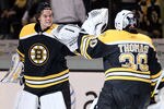 BOSTON, MA - APRIL 23:  Tuukka Rask #40 of the Boston Bruins congratulates Tim Thomas #30 after the game against the Montreal Canadiens after Game Five of the Eastern Conference Quarterfinals during the 2011 NHL Stanley Cup Playoffs at TD Garden on April 23, 2011 in Boston, Massachusetts. The Boston Bruins defeated the Montreal Canadiens 2-1 in double overtime.  (Photo by Elsa/Getty Images)