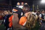 GLENDALE, AZ - JANUARY 02:  Justin Blackmon #81 of the Oklahoma State Cowboys celebrates by kissing his girlfriend and cheerleader Mariel Dunlap after Oklahoma State Cowboys won 41-38 in overtime against the Stanford Cardinal during the Tostitos Fiesta Bowl on January 2, 2012 at University of Phoenix Stadium in Glendale, Arizona.  (Photo by Donald Miralle/Getty Images)
