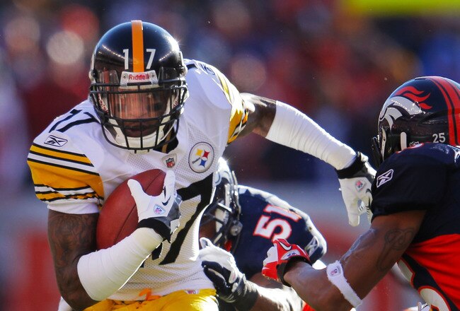 DENVER, CO - JANUARY 08:  Mike Wallace #17 of the Pittsburgh Steelers runs with the ball after a catch against the Denver Broncos during the AFC Wild Card Playoff game at Sports Authority Field at Mile High on January 8, 2012 in Denver, Colorado.  (Photo by Doug Pensinger/Getty Images)