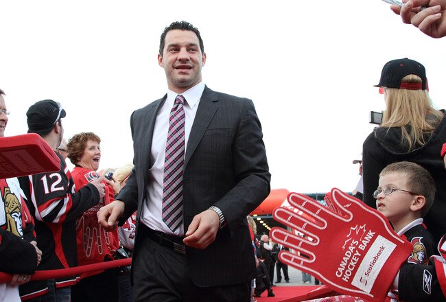 OTTAWA, CANADA - OCTOBER 11: Zenon Konopka #28 of the Ottawa Senators walks the red carpet, during the Senators' 20th anniversary pre-game ceremonies prior to the start of the NHL home opener against the Minnesota Wild at Scotiabank Place on October 11, 2011 in Ottawa, Ontario, Canada.  (Photo by Jana Chytilova/Freestyle Photography/Getty Images)