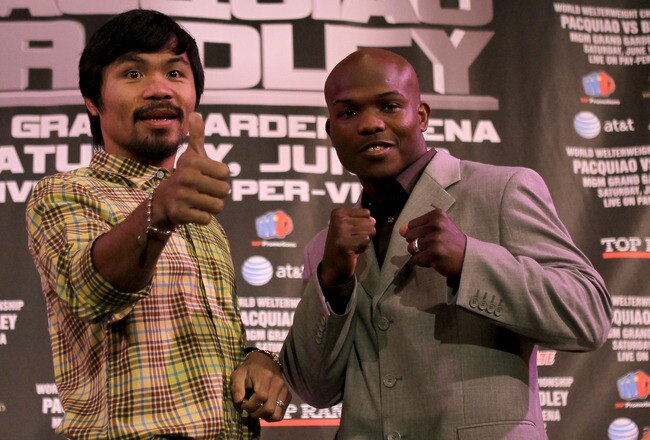 BEVERLY HILLS, CA - FEBRUARY 21:  Manny Pacquiao (L) and Timothy Bradley pose fpr photographers at a press conference announcing their upcoming World Boxing Organization welterweight championship fight at The Beverly Hills Hotel on February 21, 2012 in Beverly Hills, California.  (Photo by Stephen Dunn/Getty Images)