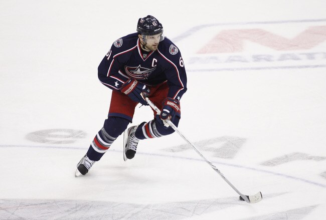 COLUMBUS, OH - JANUARY 19:  Rick Nash #61 of the Columbus Blue Jackets skates the puck up ice during the game against the Nashville Predators at Nationwide Arena on January 19, 2012 in Columbus, Ohio.  The Predators defeated the Blue Jackets 3-0.  (Photo by John Grieshop/Getty Images)