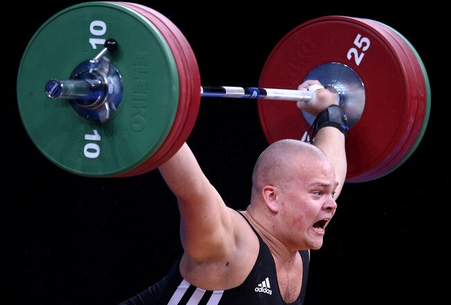 LONDON, ENGLAND - DECEMBER 11:  Mart Seim of Estonia makes a lift in the Men's 105kg during the Weightlifting LOCOG Test Event for London 2012 at ExCel on December 11, 2011 in London, England.  (Photo by Julian Finney/Getty Images)