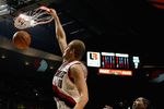 PORTLAND, OR - DECEMBER 6:  Joel Przybilla #10 of the Portland Trail Blazers slam dunks past Udonis Haslem #40 of the Miami Heat during the game on December 6, 2007 at the Rose Garden in Portland, Oregon.  The Blazers won 112-106.  NOTE TO USER: User expressly acknowledges and agrees that, by downloading and or using this Photograph, user is consenting to the terms and conditions of the Getty Images License Agreement.