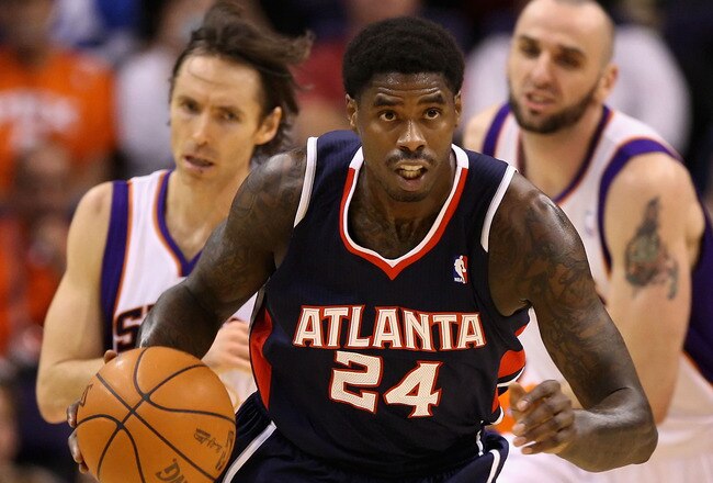 PHOENIX, AZ - FEBRUARY 15:  Marvin Williams #24 of the Atlanta Hawks handles the ball during the NBA game against the Phoenix Suns at US Airways Center on February 15, 2012 in Phoenix, Arizona. The Hawks defeated the Suns 101-99.  NOTE TO USER: User expressly acknowledges and agrees that, by downloading and or using this photograph, User is consenting to the terms and conditions of the Getty Images License Agreement.  (Photo by Christian Petersen/Getty Images)