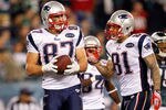 PHILADELPHIA, PA - NOVEMBER 27:  (L-R) Rob Gronkowski #87 and Aaron Hernandez #81 of the New England Patriots react after Gronkowski caught a 24-yard touchdown reception in the fourth quarter against the Philadelphia Eagles at Lincoln Financial Field on November 27, 2011 in Philadelphia, Pennsylvania.  (Photo by Rich Schultz/Getty Images)