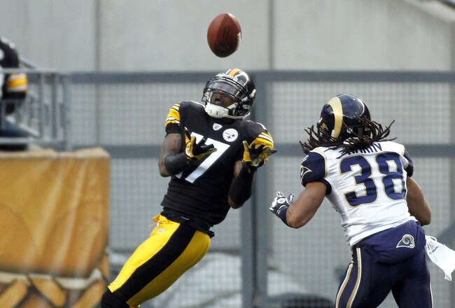PITTSBURGH, PA - DECEMBER 24:  Mike Wallace #17 of the Pittsburgh Steelers makes a catch against  Josh Gordy #38 of the St. Louis Rams during the game on December 24, 2011 at Heinz Field in Pittsburgh, Pennsylvania.  The Steelers won 27-0.  (Photo by Justin K. Aller/Getty Images)