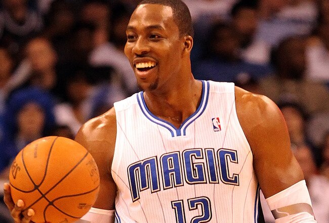 ORLANDO, FL - FEBRUARY 06:  Dwight Howard #12 of the Orlando Magic smiles during the game against the Los Angeles Clippers at Amway Center on February 6, 2012 in Orlando, Florida.   NOTE TO USER: User expressly acknowledges and agrees that, by downloading and or using this Photograph, user is consenting to the terms and conditions of the Getty Images License Agreement.  (Photo by Sam Greenwood/Getty Images)